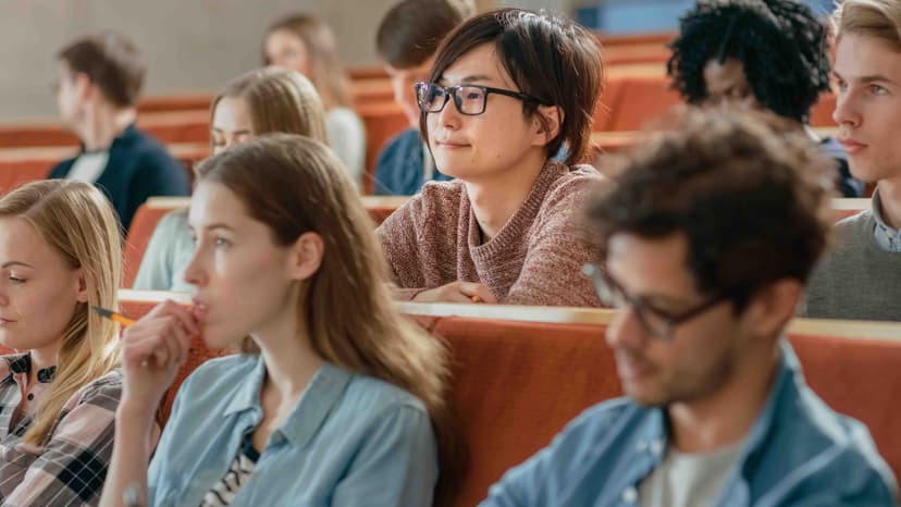 Students in class engaging with a lecture.